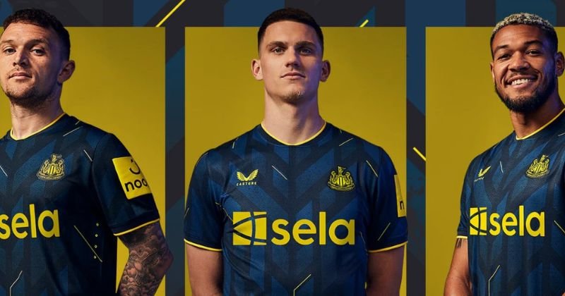players wearing newcastle united 2023-24 third shirt in blue and yellow